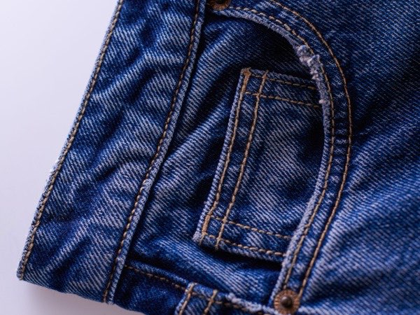 Stack of finished denim jeans after washing